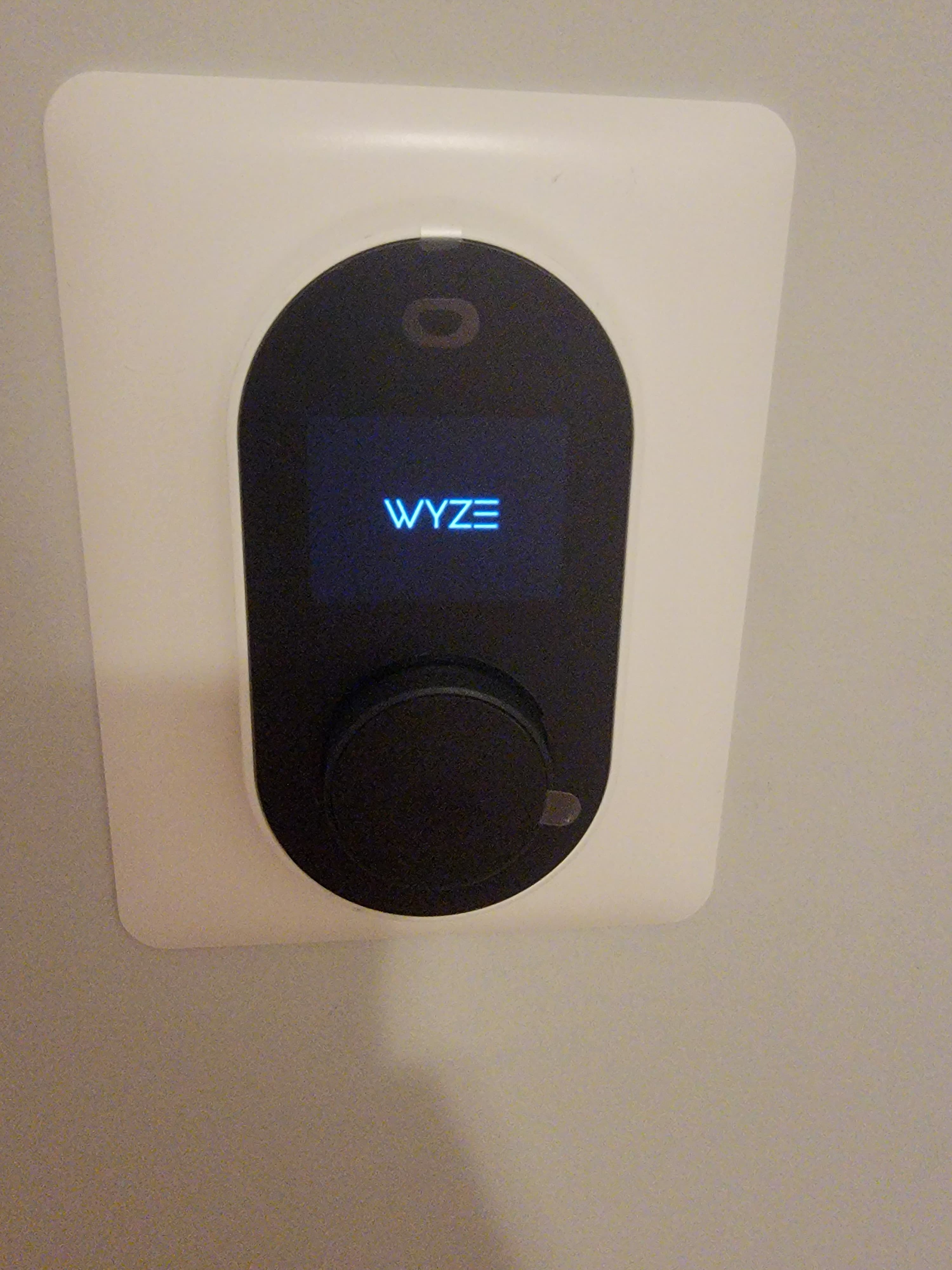 Wall-mounted Wyze smart camera powered on and ready for setup